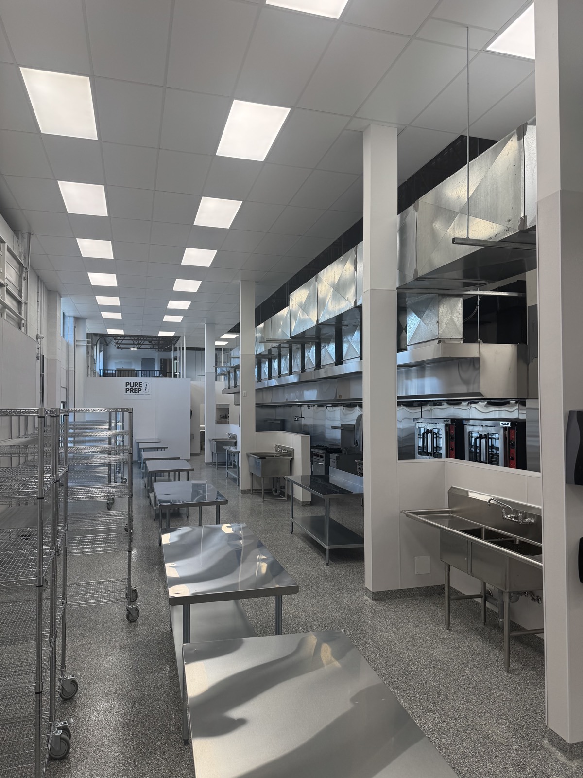 Rows of fully equipped private kitchen stations at PurePrep Langley