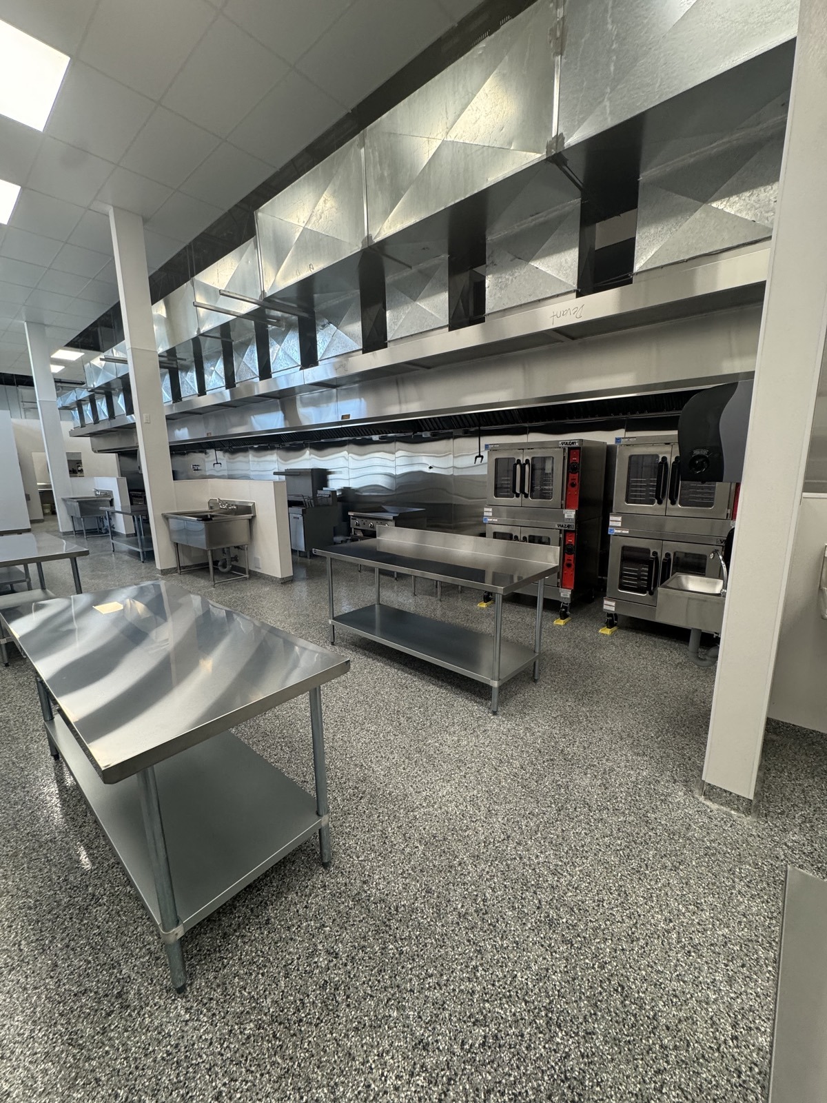 Commercial cookline under ventilation hoods at PurePrep Langley