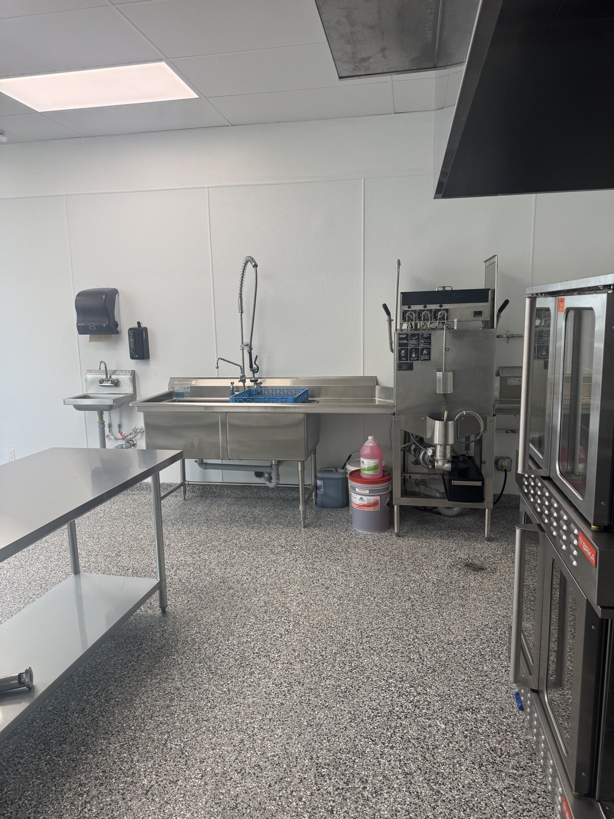 Commercial dishwashing station at PurePrep near Victoria