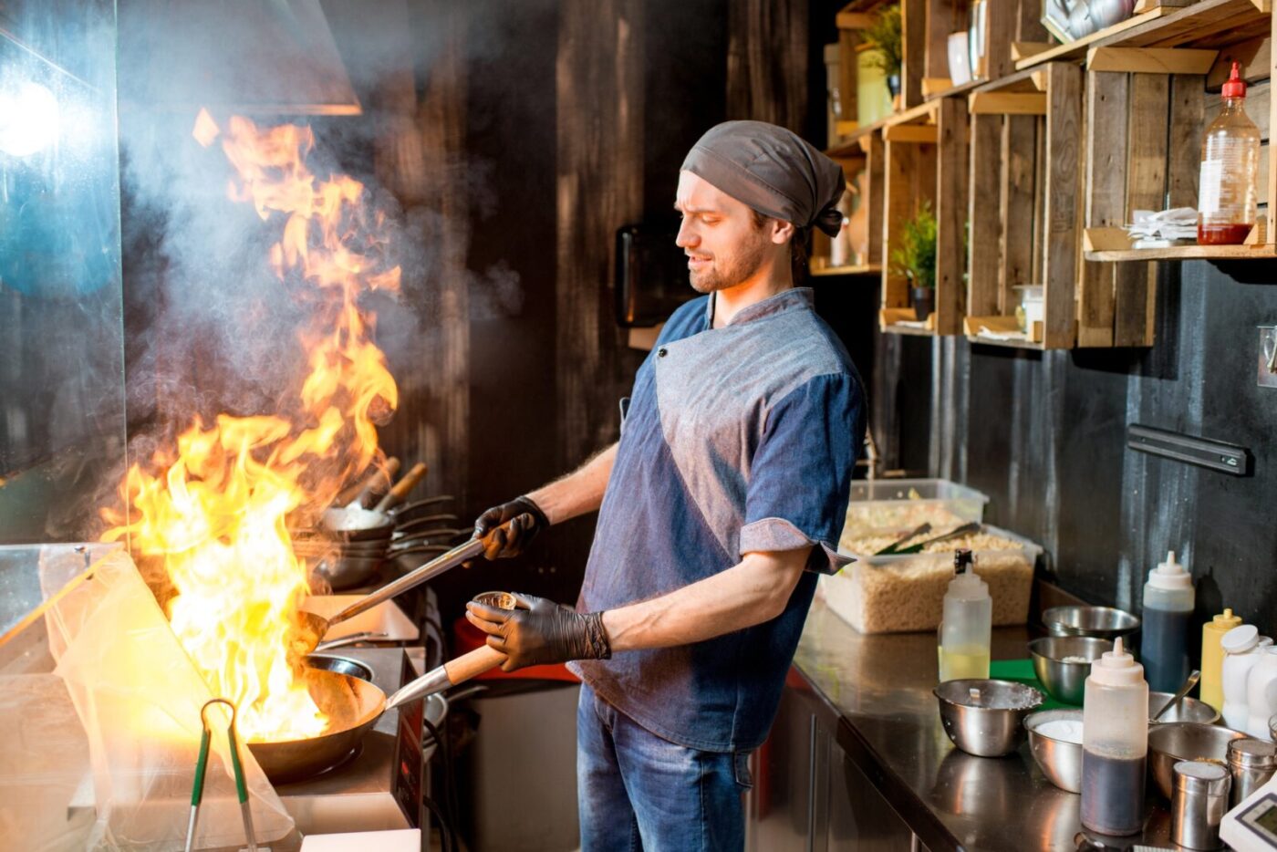 Chief cook cooking at the asian kitchen